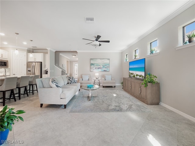 living room featuring crown molding and ceiling fan