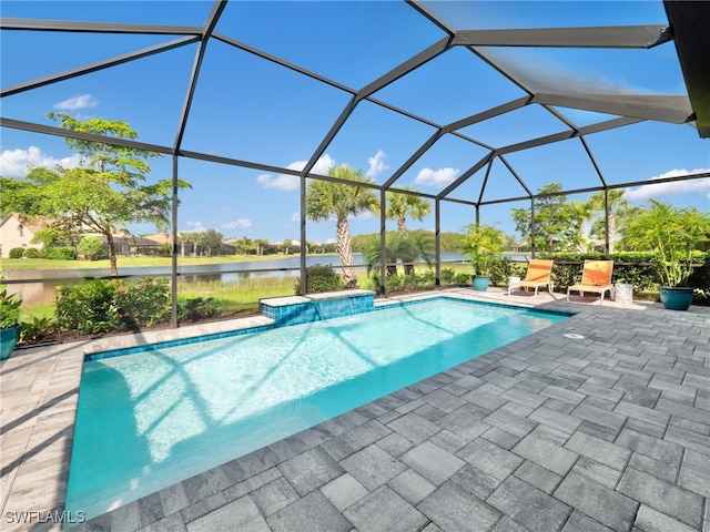 view of pool featuring a water view, a lanai, and a patio area