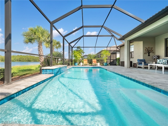 view of pool featuring a water view, glass enclosure, and a patio