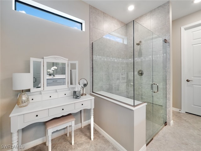 bathroom featuring vanity, tile patterned flooring, and an enclosed shower