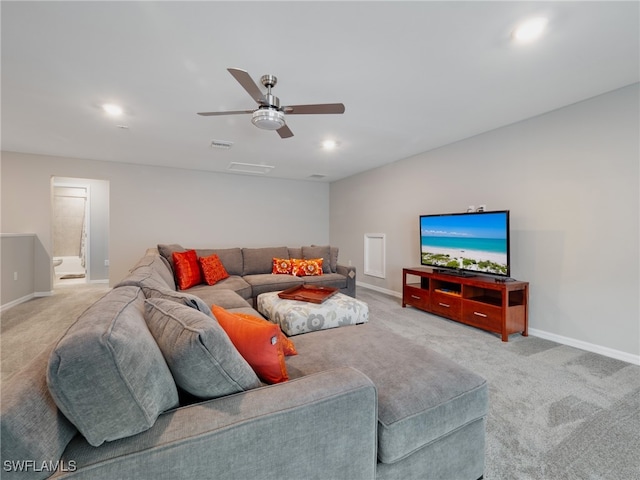 living room featuring ceiling fan and light colored carpet