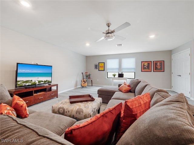 living room with ceiling fan and light carpet