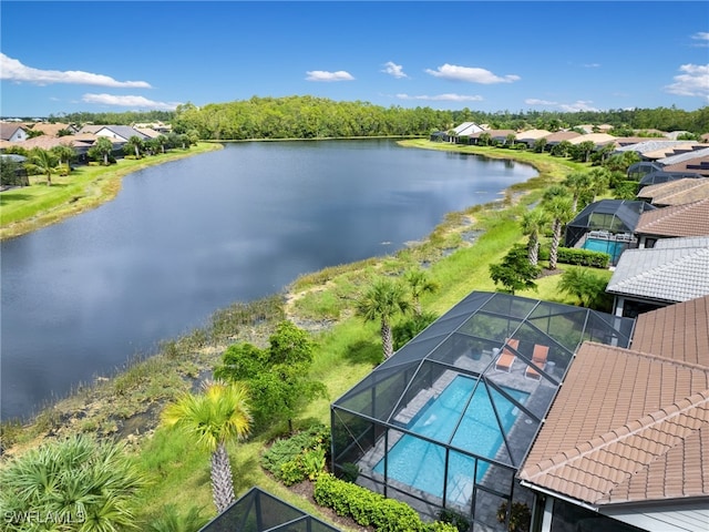 birds eye view of property with a water view