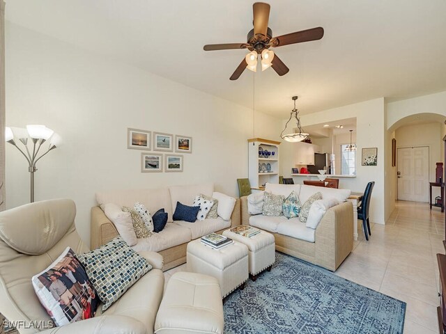 tiled living room featuring ceiling fan