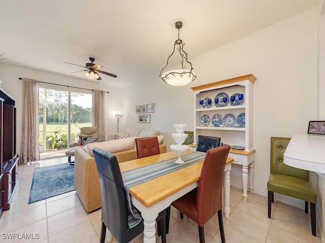 dining room with ceiling fan and light tile patterned flooring