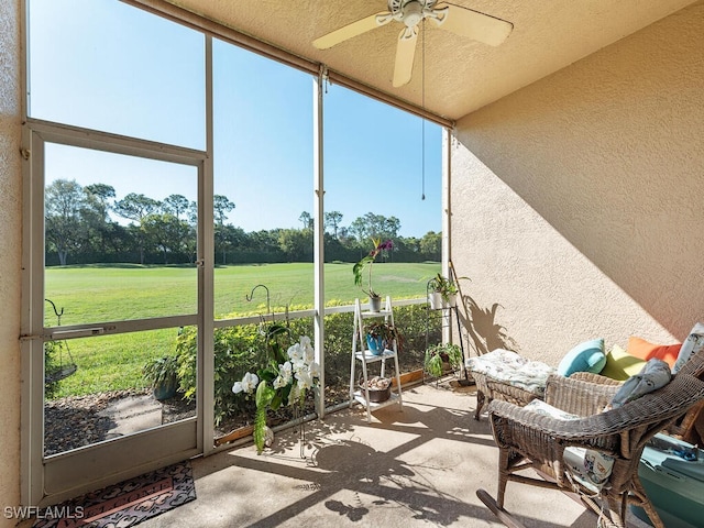 sunroom / solarium with ceiling fan