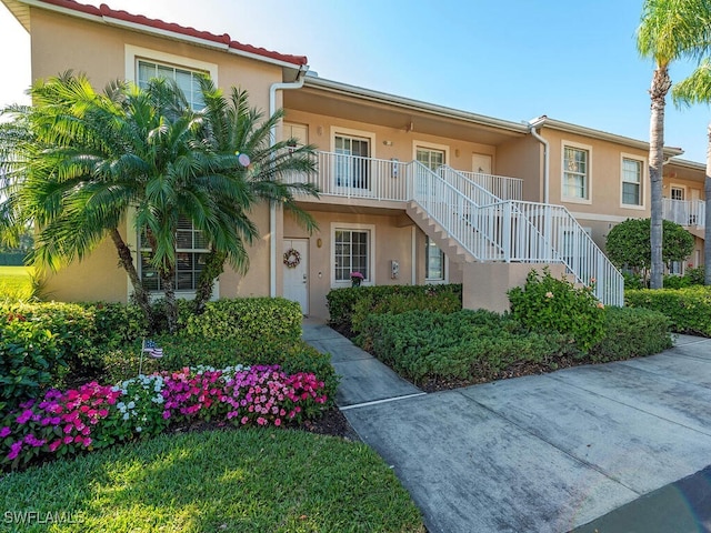 view of front of property with a balcony