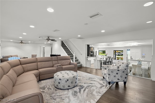 living area with stairs, recessed lighting, wood finished floors, and a ceiling fan