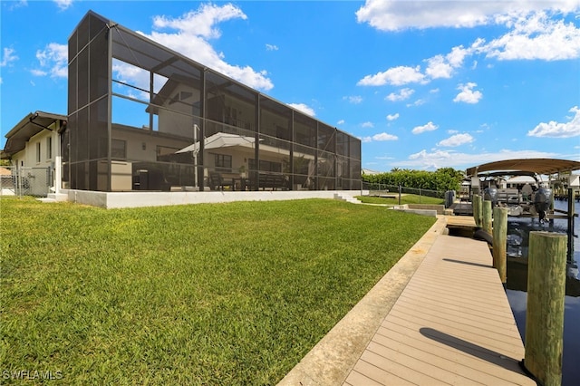 5811 SW 1st Pl, Cape Coral, FL 33914 - dock area featuring a yard and glass enclosure