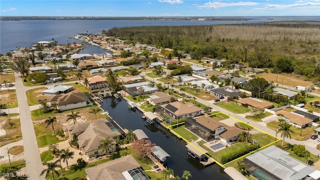 aerial perspective of suburban area featuring property boundaries highlighted and a nearby body of water