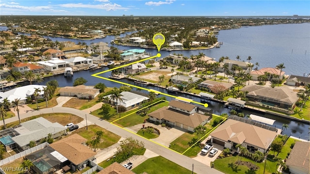 5811 SW 1st Pl, Cape Coral, FL 33914 - aerial view of residential area featuring property boundaries highlighted and a large body of water