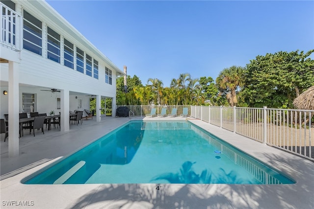 view of pool with a patio and ceiling fan