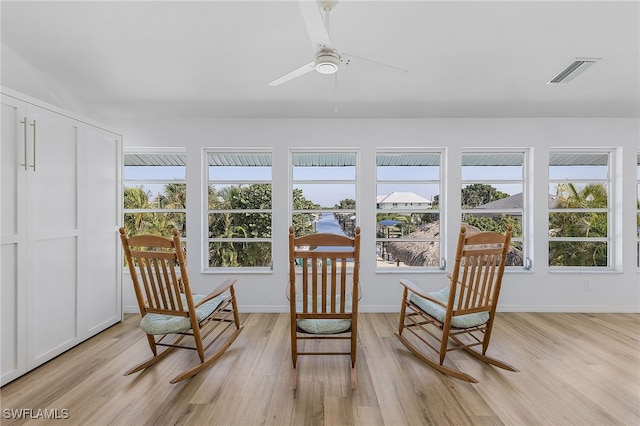 sunroom / solarium with ceiling fan