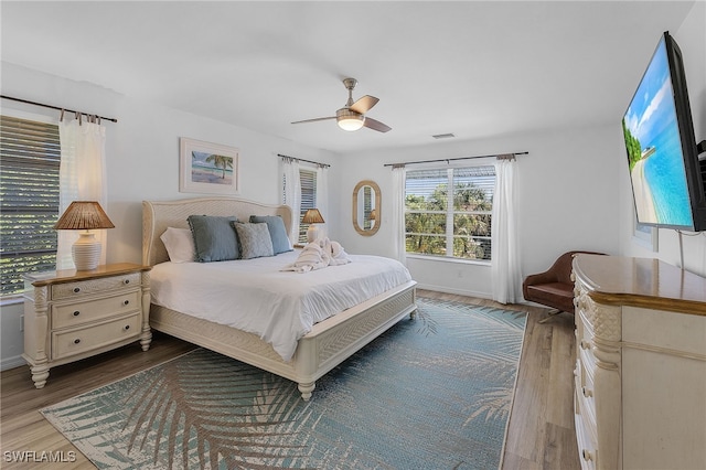 bedroom featuring hardwood / wood-style floors and ceiling fan