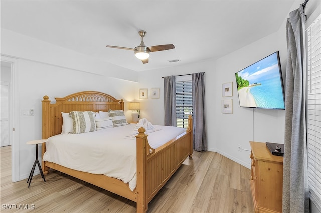 bedroom featuring ceiling fan and light hardwood / wood-style flooring