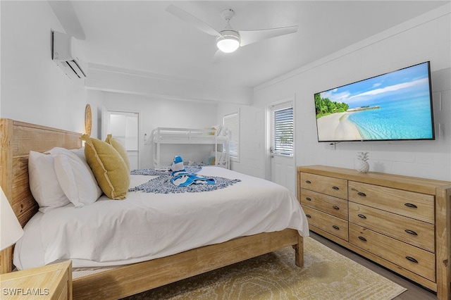 bedroom featuring ceiling fan and a wall mounted AC