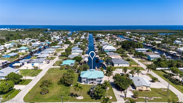 drone / aerial view with a water view