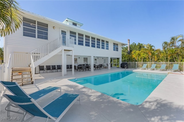 view of swimming pool featuring a patio