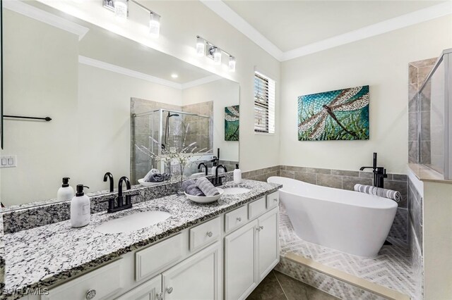 bathroom featuring tile patterned flooring, vanity, ornamental molding, and shower with separate bathtub