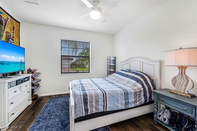 bedroom featuring dark hardwood / wood-style flooring and ceiling fan