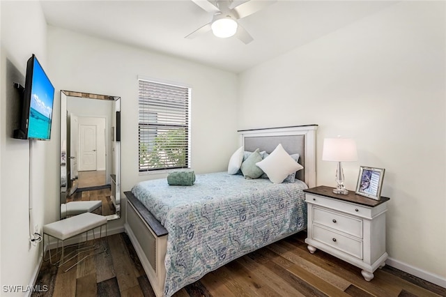 bedroom featuring dark hardwood / wood-style flooring and ceiling fan