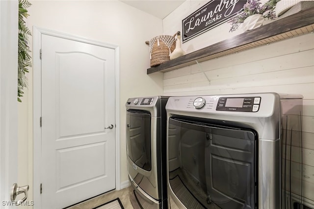 washroom with washing machine and clothes dryer