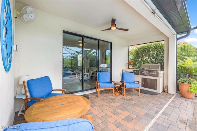 view of patio / terrace with ceiling fan and a grill