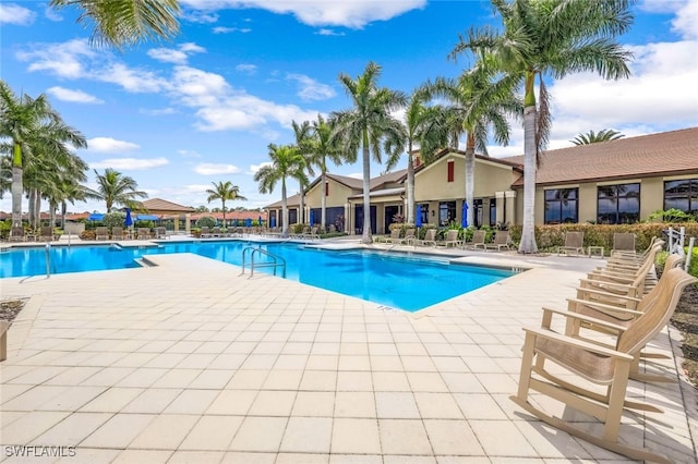 view of swimming pool featuring a patio area