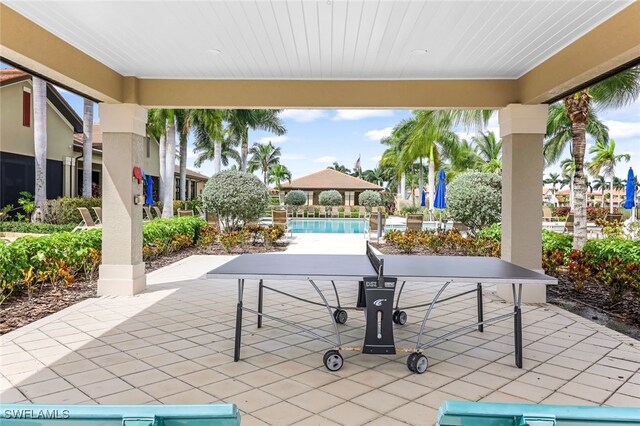 view of patio / terrace featuring a gazebo and a community pool