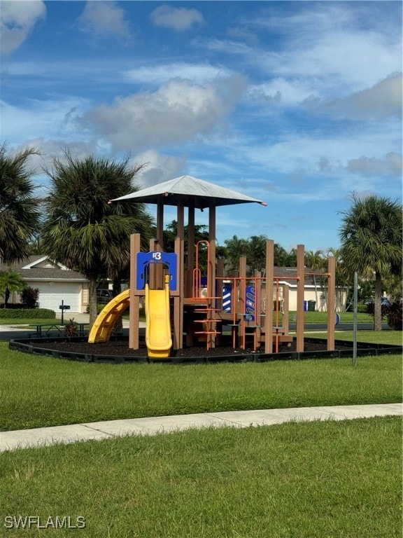 view of jungle gym featuring a lawn