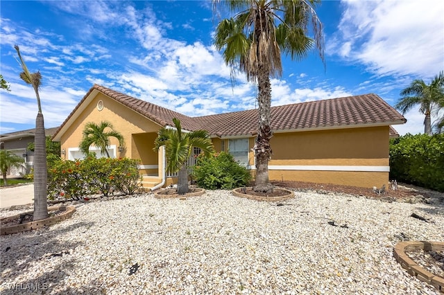 view of front of property with a garage