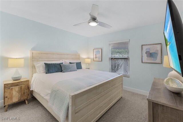 bedroom featuring ceiling fan and light colored carpet