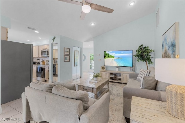 tiled living room with ceiling fan and lofted ceiling