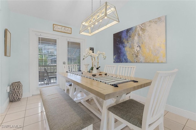 dining area featuring light tile patterned floors