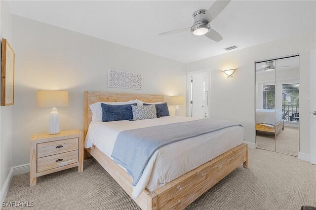 bedroom featuring ceiling fan, a closet, and carpet