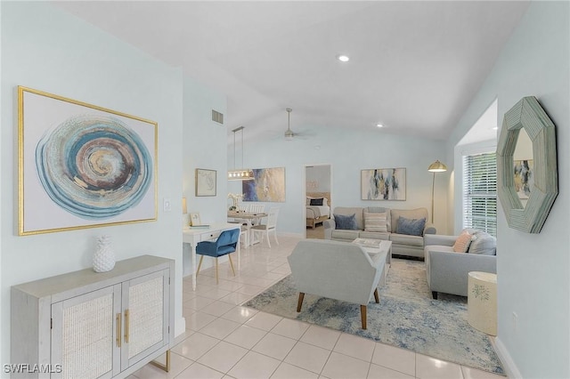 living room featuring vaulted ceiling, ceiling fan, and light tile patterned floors