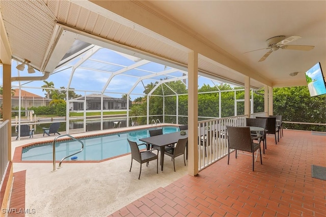 view of pool featuring a lanai, ceiling fan, and a patio area