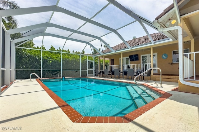 view of pool with a lanai and a patio area