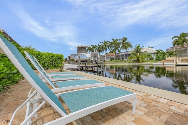 exterior space featuring a boat dock and a water view