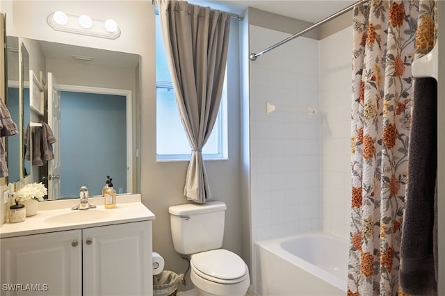 full bathroom with shower / tub combo, vanity, and toilet