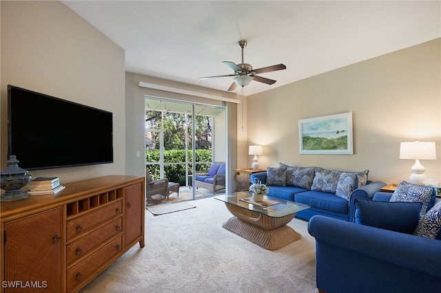 carpeted living room featuring ceiling fan