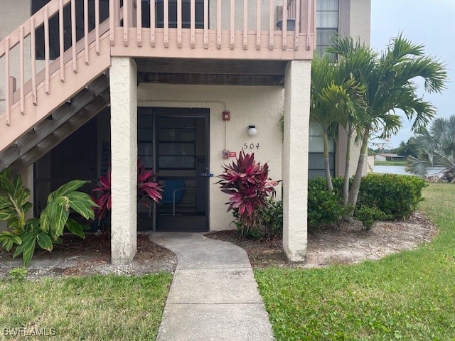 entrance to property with a balcony