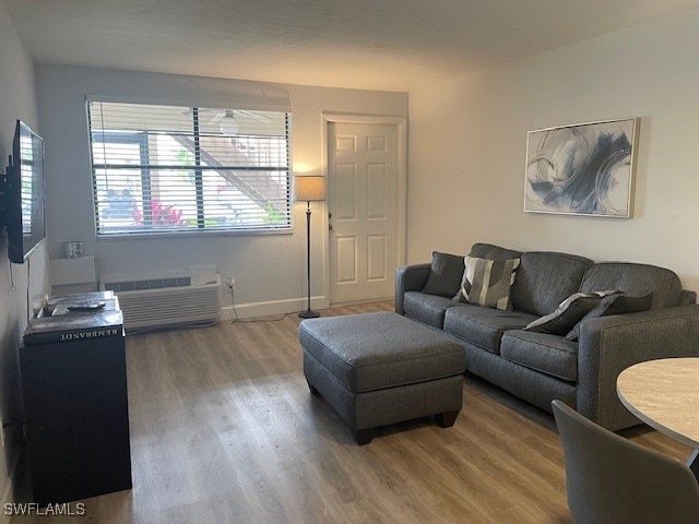 living room with hardwood / wood-style flooring