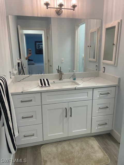 bathroom featuring hardwood / wood-style flooring and vanity