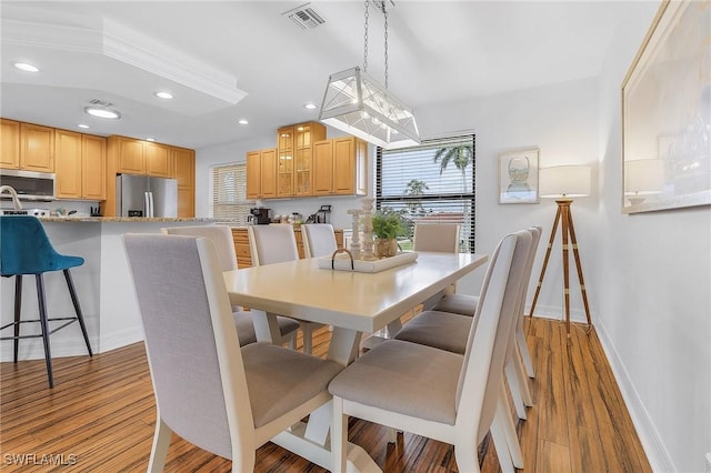 dining area with light hardwood / wood-style floors