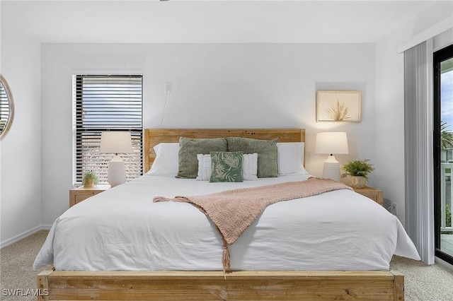carpeted bedroom with access to outside