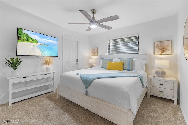 bedroom featuring ceiling fan and light carpet