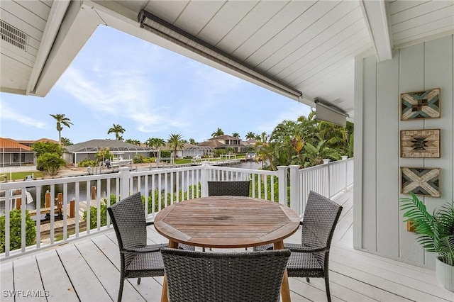 wooden deck with a water view