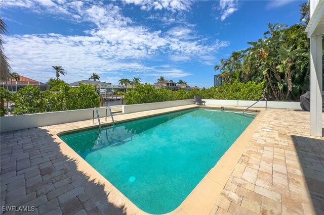 view of swimming pool featuring a patio