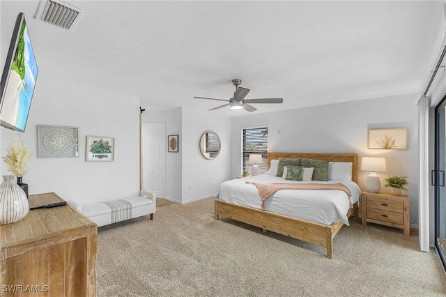 carpeted bedroom featuring ceiling fan